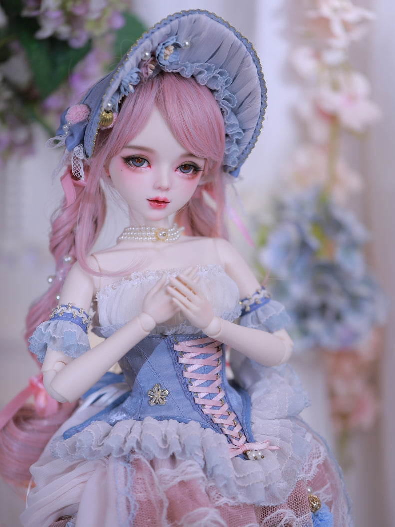 Close-up of Carla Doll by Sukuroi, showcasing her pink hair and detailed blue dress