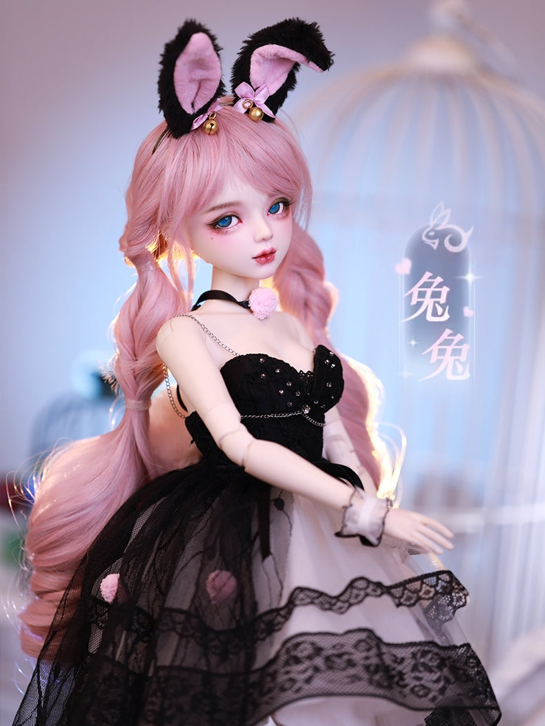 Aiko Doll seated in a serene pose
