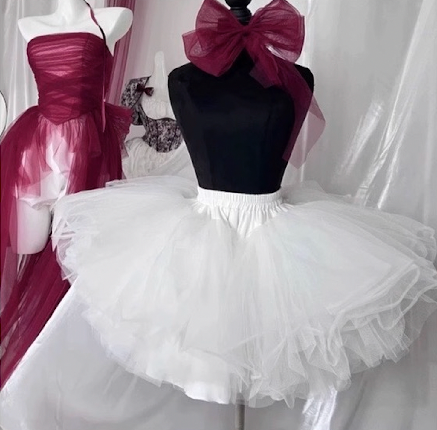 White tulle petticoat skirt on mannequin, ideal for adding volume to a Short Off Shoulder Lolita Dress