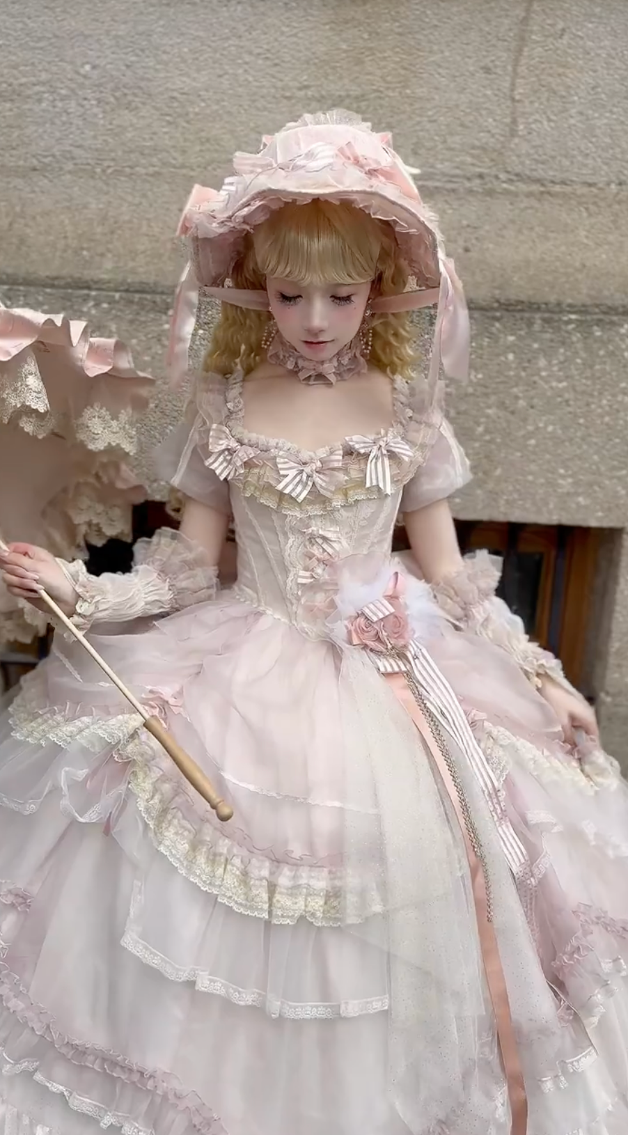 Pink Lolita dress with bonnet and parasol