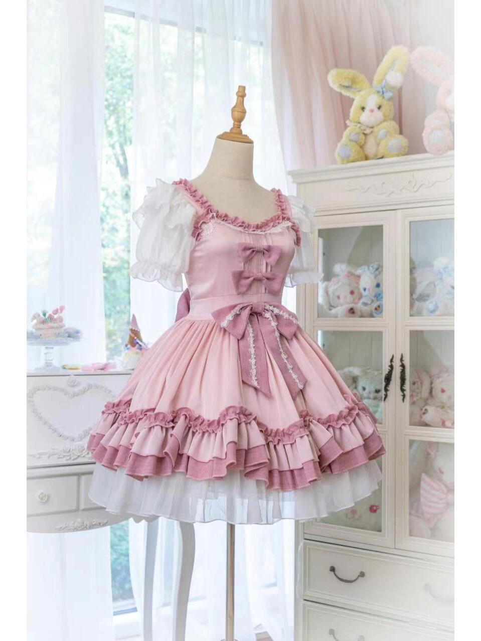 Front view of Pink Lolita Dress with bows and ruffled skirt