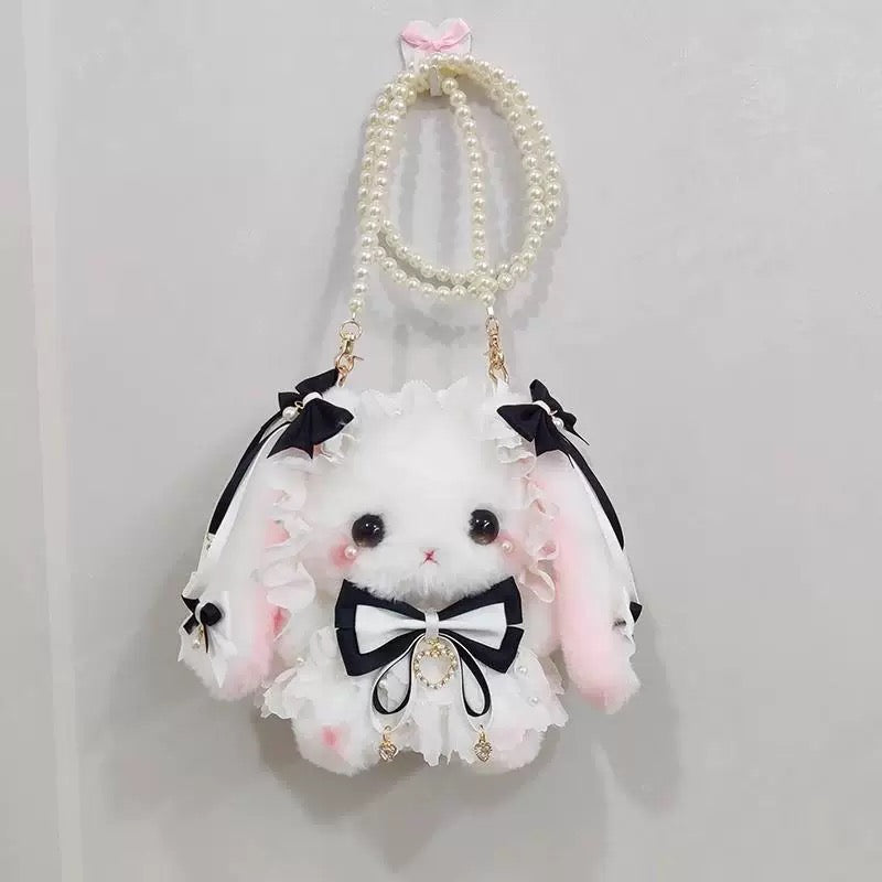 Fluffy white bunny plush bag with pink accents and pearl strap