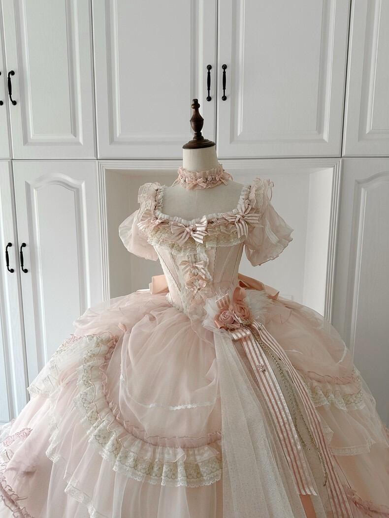 Pink frilly Lolita dress with bows