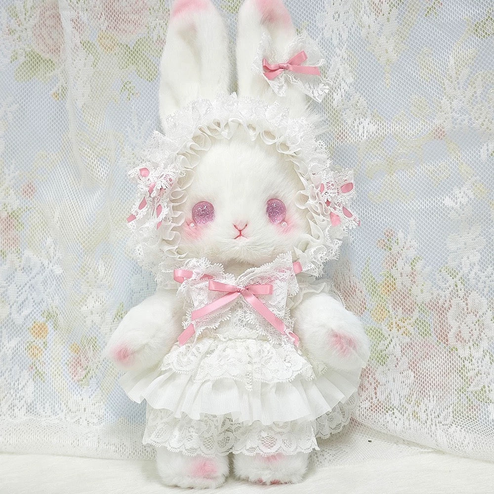 Pink plush bunny bag featuring delicate lace accents