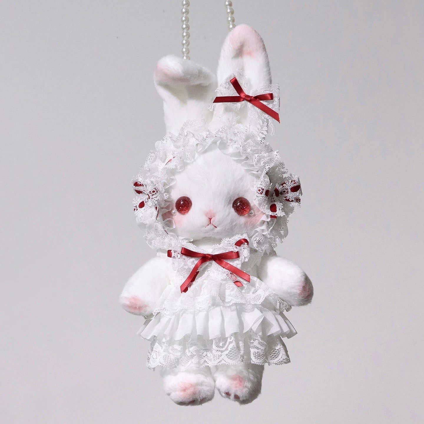 Close-up of Bunny Lace Lolita Bag featuring a delicate red ribbon