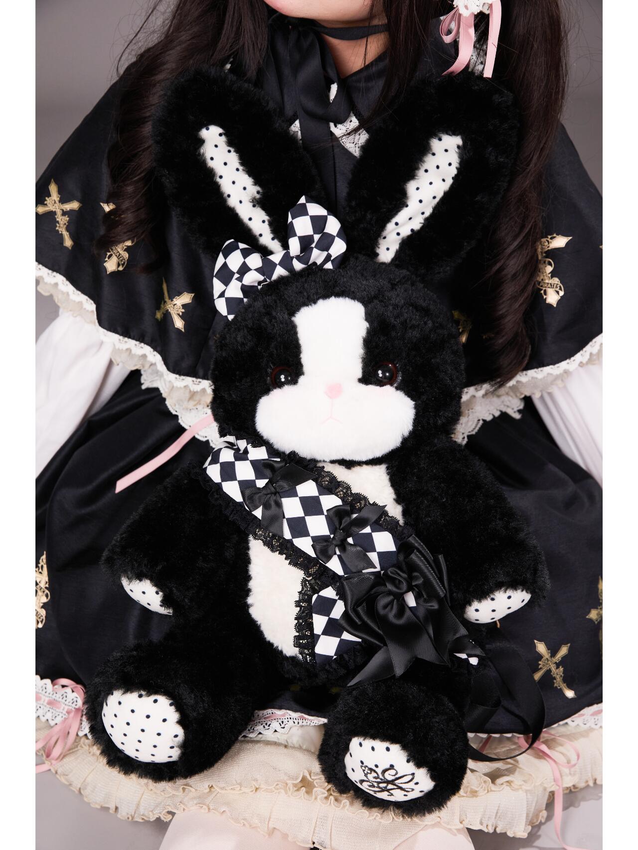 Black and white plush bunny with long ears