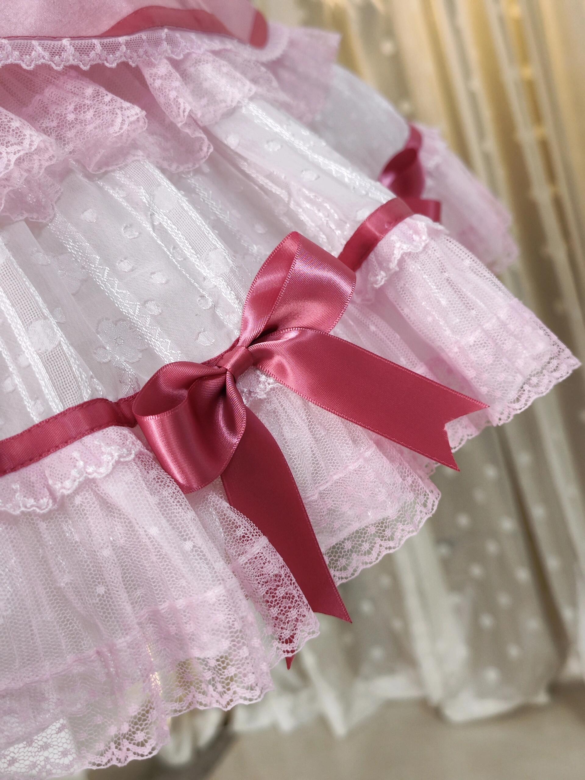 Pink bow on lace frill dress