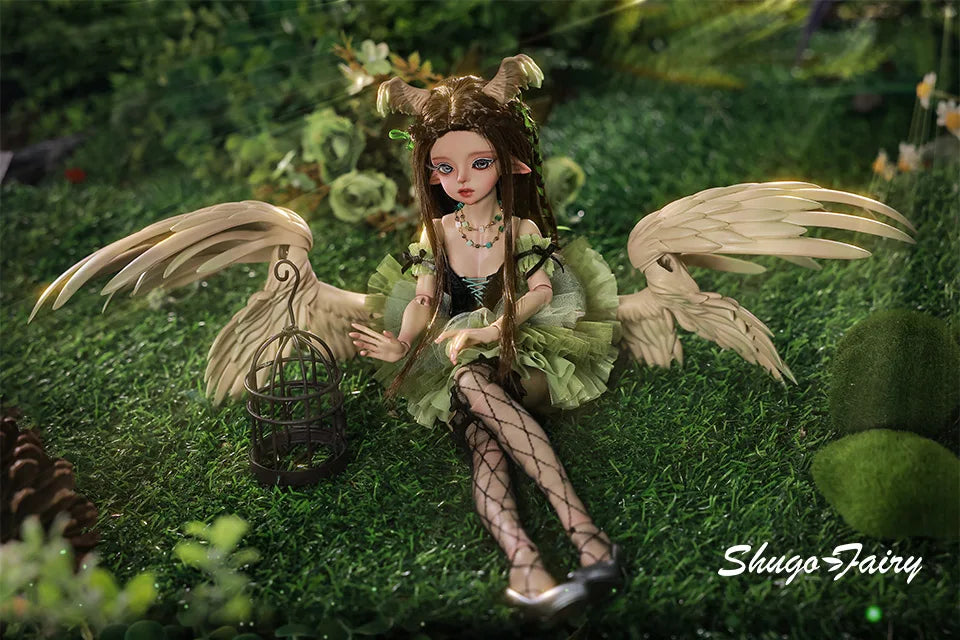 ShugaFairy Pegasus BJD doll with green tutu and wings, sitting gracefully in a natural setting with a birdcage