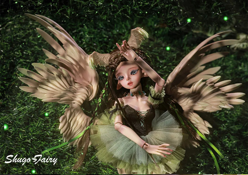 ShugaFairy Pegasus doll in a green tutu with angel wings, gracefully posing on the grass