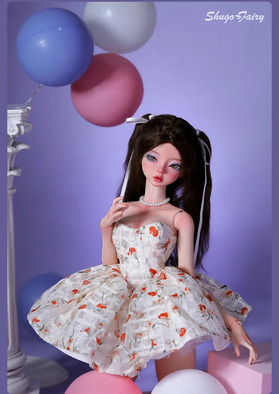 BJD doll in a white Doll Floral Dress with orange flower print, posing with pastel balloons