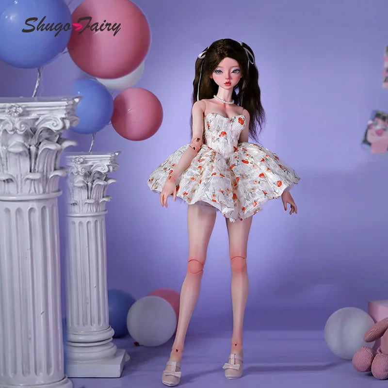 Doll in a white Doll Floral Dress with orange flower prints, posing beside pastel balloons
