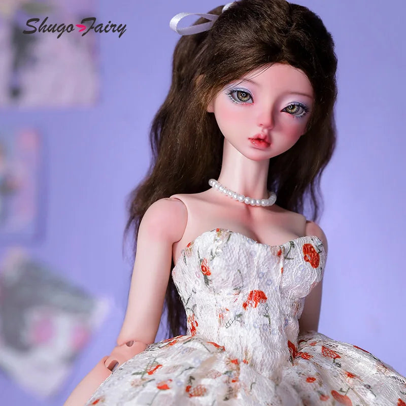 Doll wearing a white Doll Floral Dress with orange floral patterns
