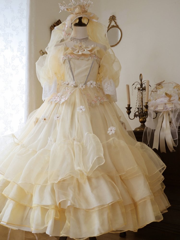 Floral princess dress in soft yellow with lace sleeves and layered tulle