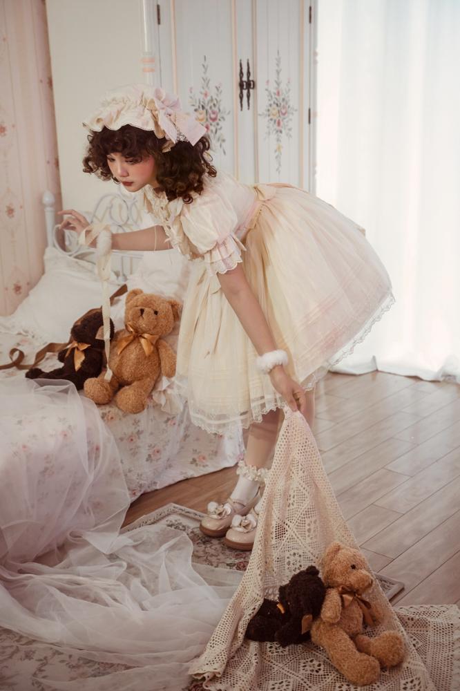 Charming Lolita Fashion look with cream dress and teddy bear, a must-have from Sukuroi