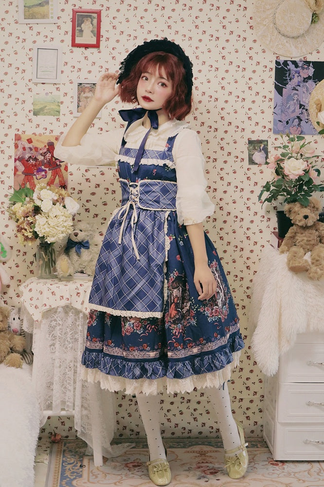 Model posing in a blue Little Red Riding Hood jumper skirt with floral and plaid accents