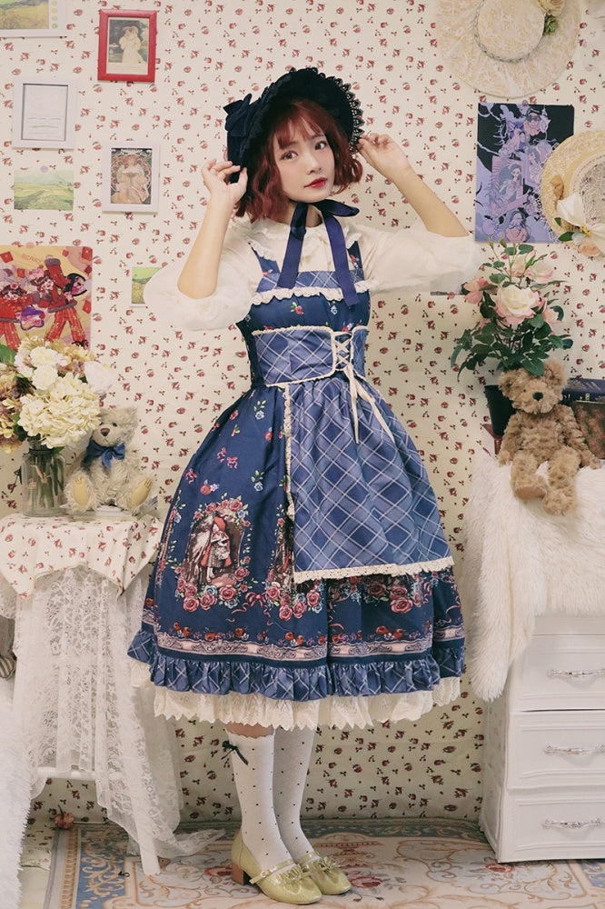 Woman wearing a blue Little Red Riding Hood jumper skirt with lace and apron details