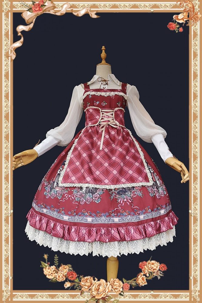 Display of red Little Red Riding Hood jumper skirt with apron and floral details on mannequin