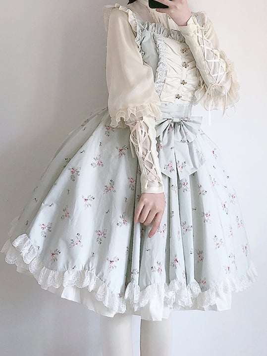 Floral light green jumper skirt with lace and bow details
