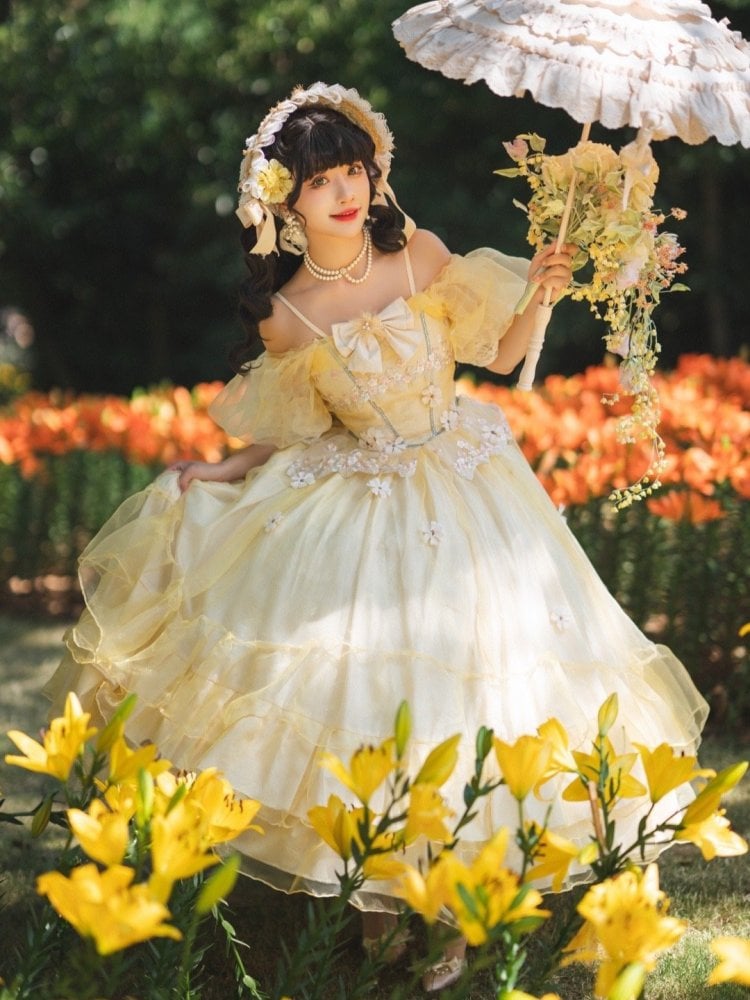Light yellow floral princess gown with ruffled hem and white bows