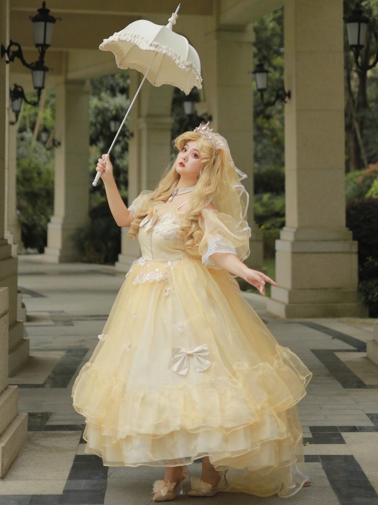 Elegant light yellow floral princess gown with sheer detailing