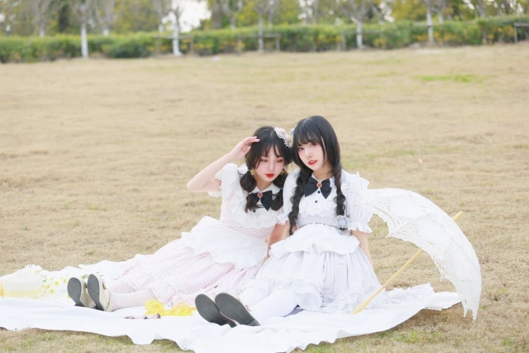 Two girls in vintage dresses