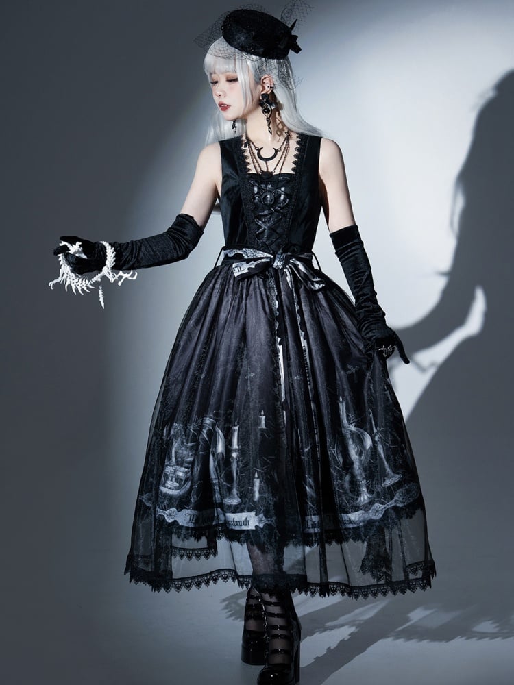 Women’s black jumper skirt outfit with gothic dragon print