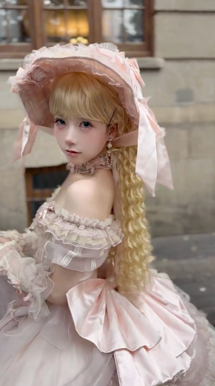 Side view of pink Lolita dress with bonnet