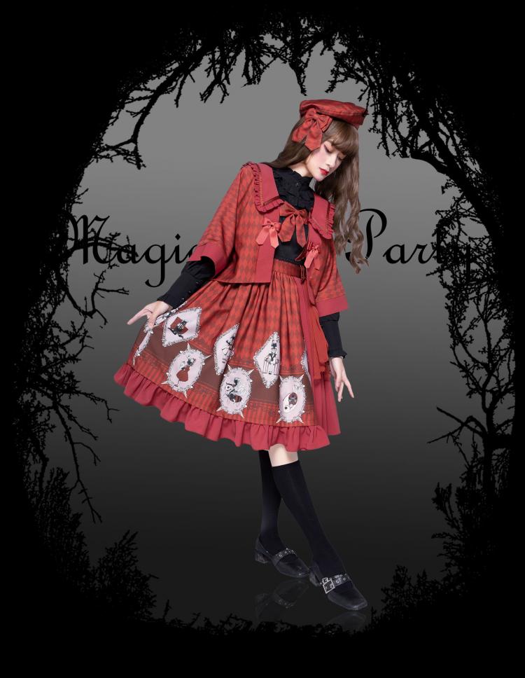 Model in Red No One Lives Jumper Skirt with Matching Cape