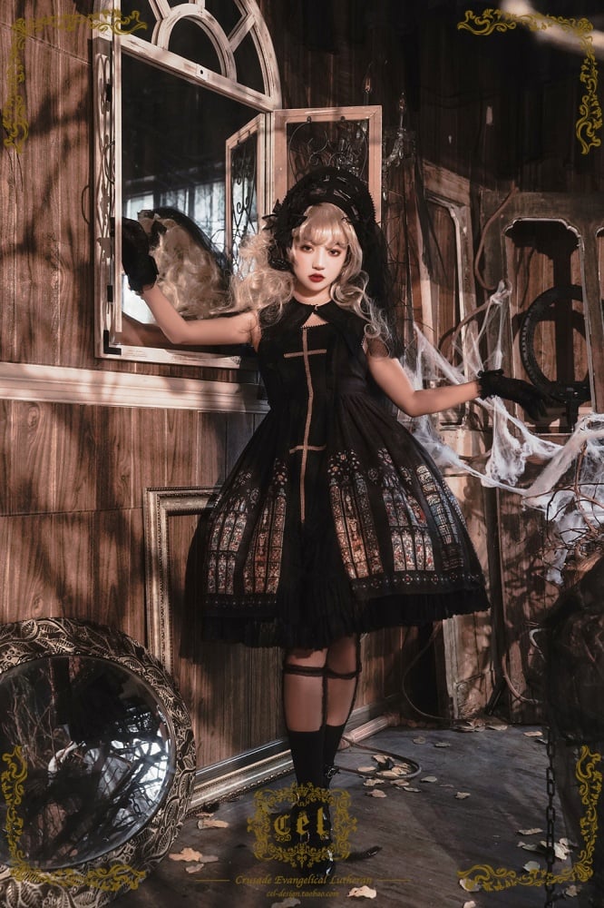 Gothic fashion model in black dress with stained glass
