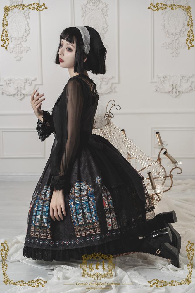 Side profile of model in black gothic dress with lace details