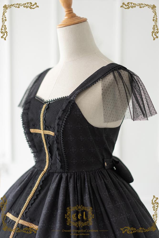 Close-up of black gothic dress with stained glass design