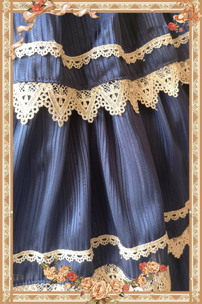 Close-up of Cake Tree Tiered Flounce Skirt in navy blue with beige lace detailing