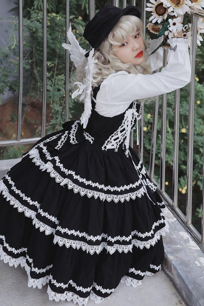Cake Tree Tiered Flounce Skirt in black with white lace accents, paired with a white blouse and black hat
