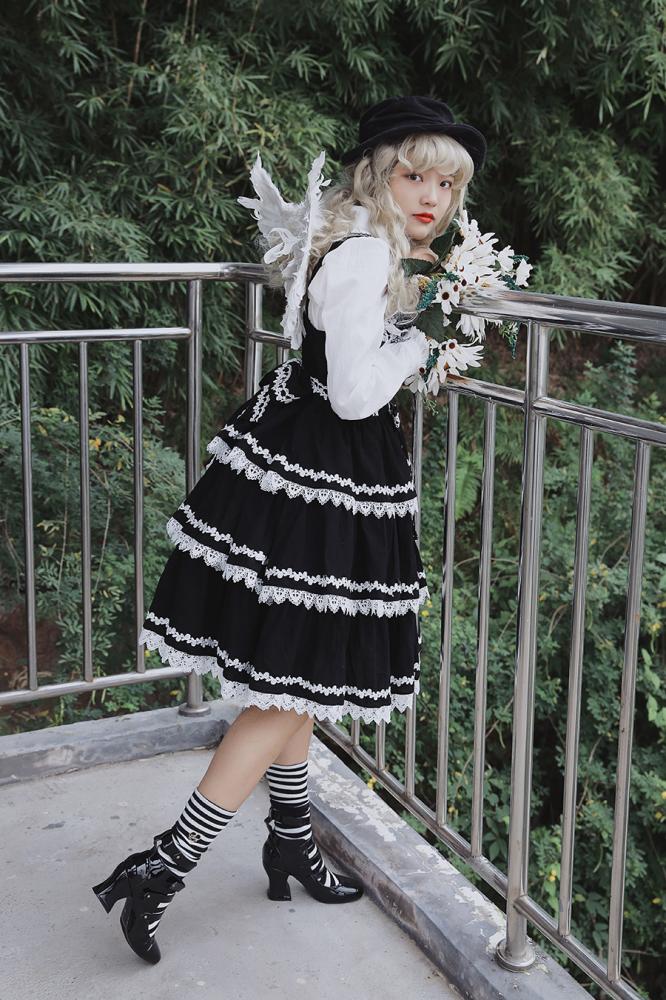 Black Cake Tree Tiered Flounce Skirt styled with white lace and a floral bouquet