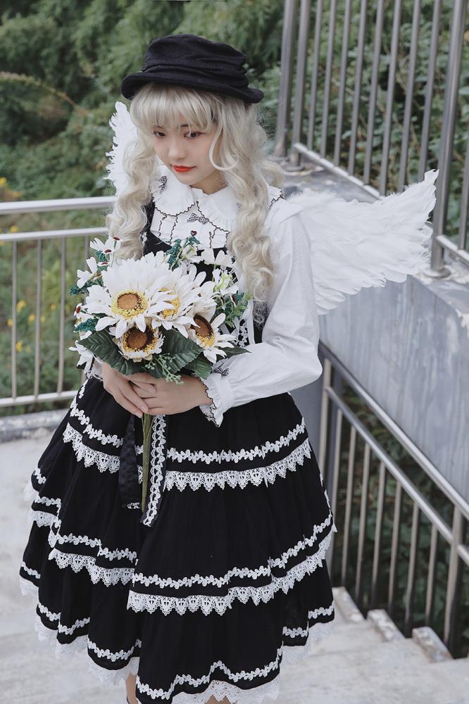 Black Cake Tree Tiered Flounce Skirt with white lace, paired with a floral bouquet and angel wings